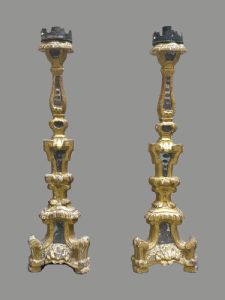 A pair of carved and giltwood candlesticks with mirrored inserts, southern Italy 17th century.